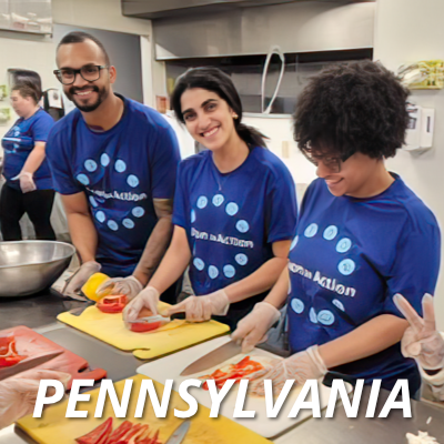 Three Alcon volunteers preparing meals