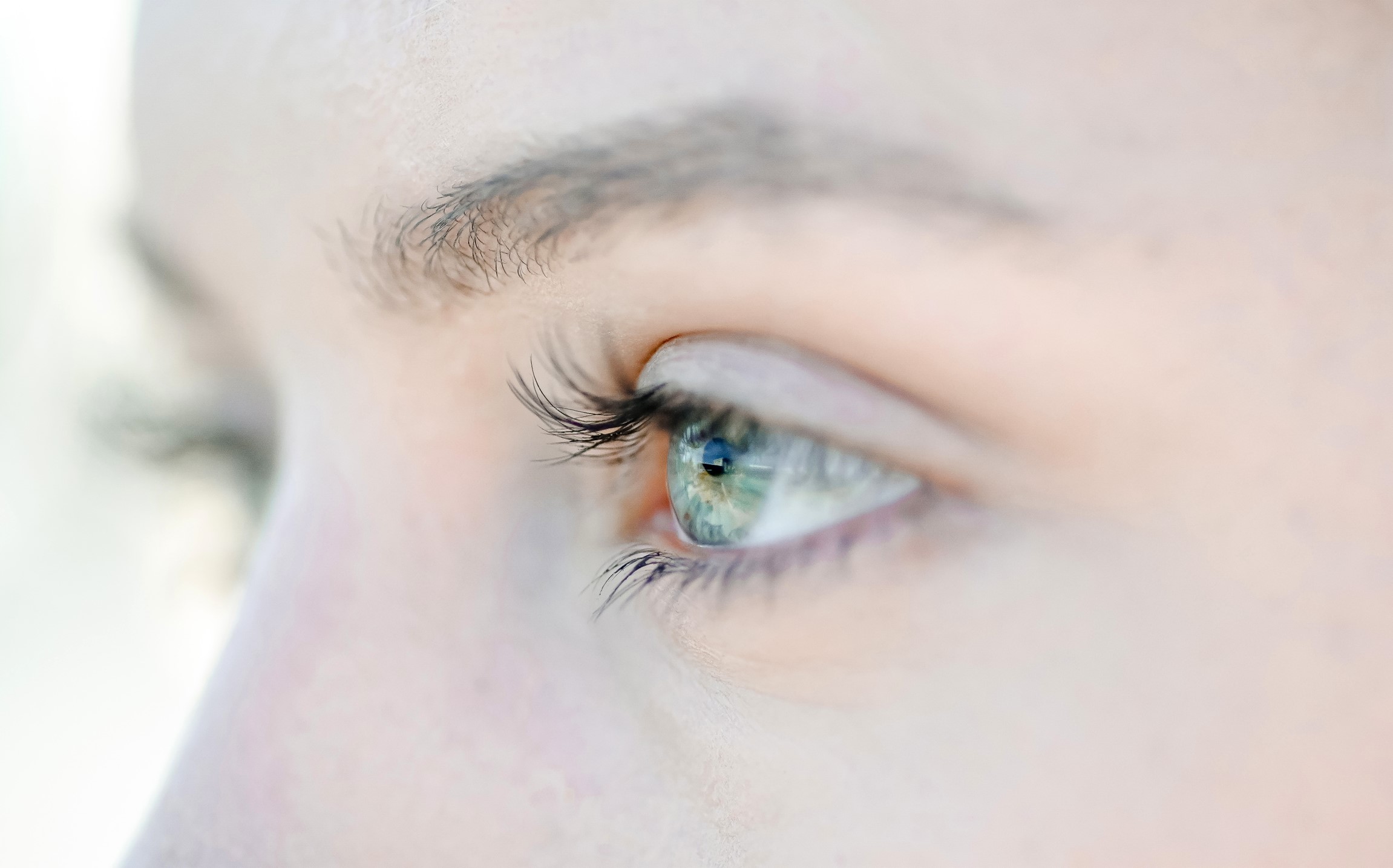 Alcon Precision 7, close up profile of a woman's eye
