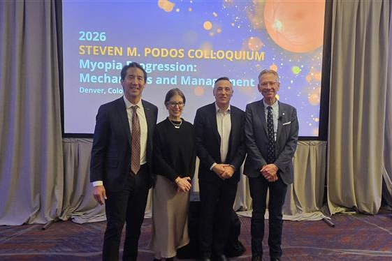 4 people standing on the stage at the 2026 Steven M. Podos Colloquium