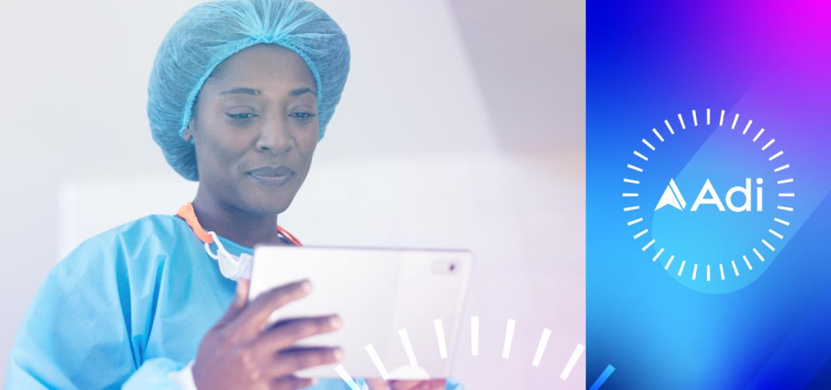 Woman in surgical gown and cap looking at ipad, Adi logo on right