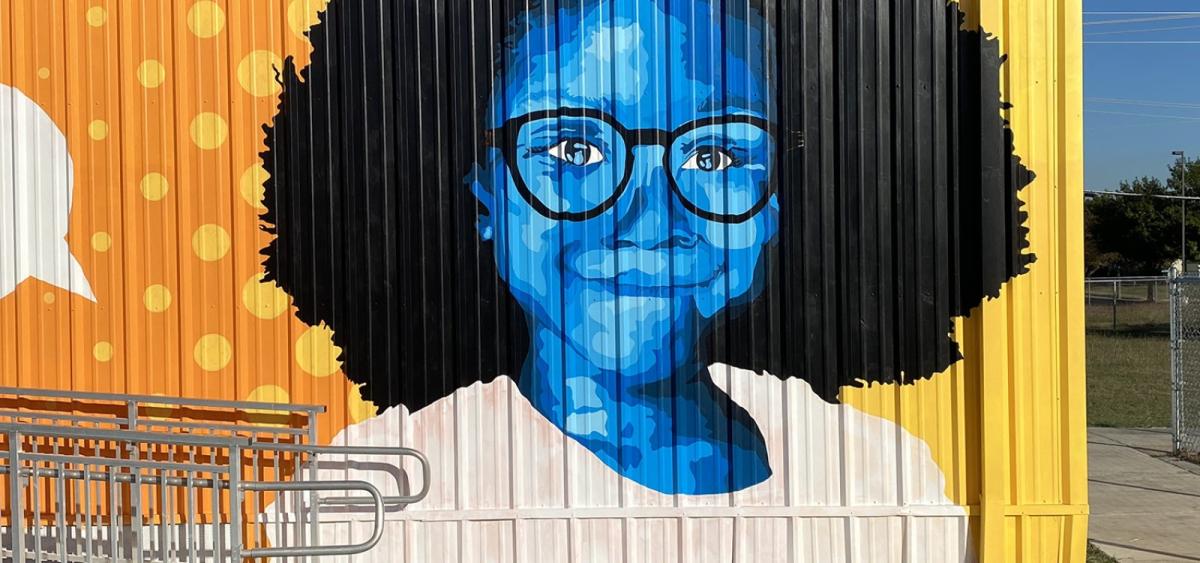 Mural of a girl wearing glasses