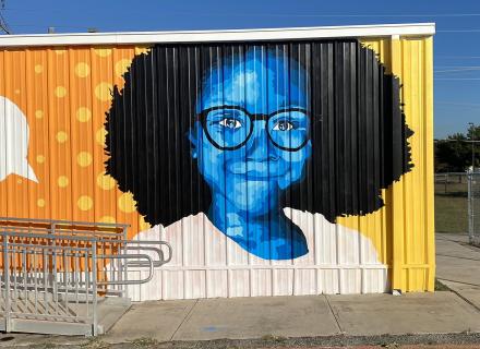 Mural of a girl wearing glasses