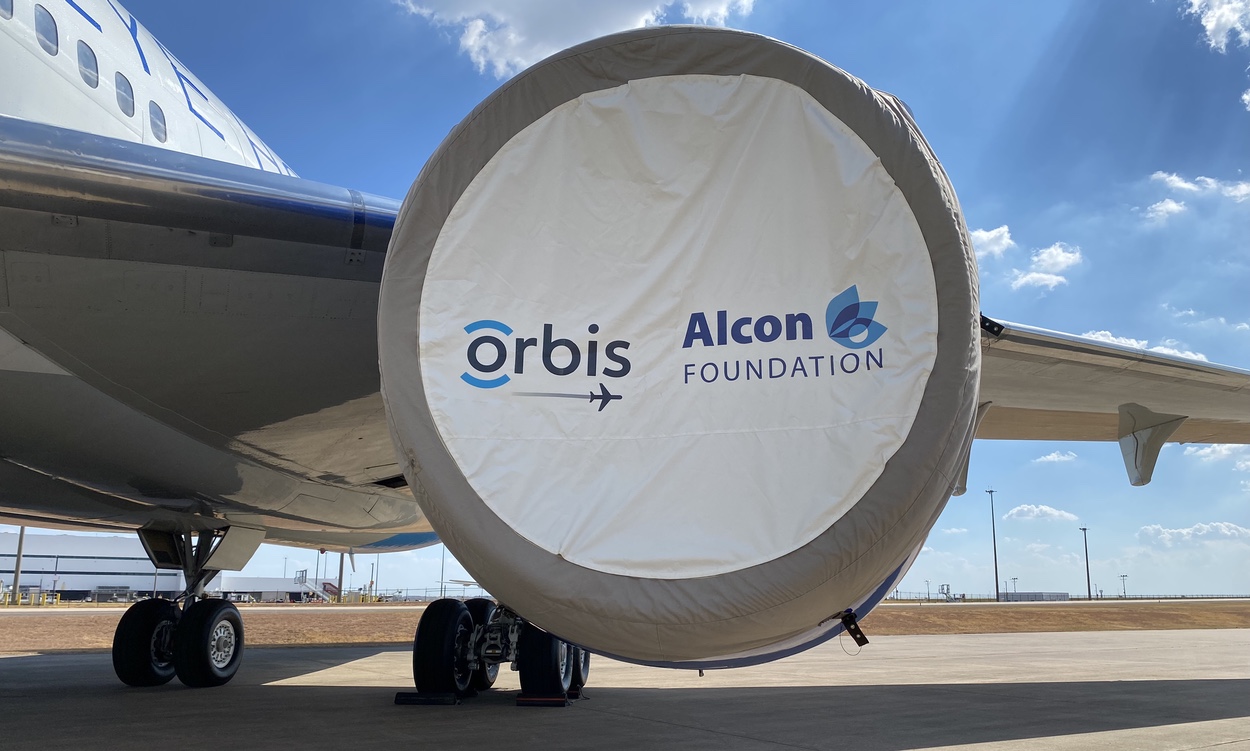 Airplane with Orbis & Alcon Foundation logos