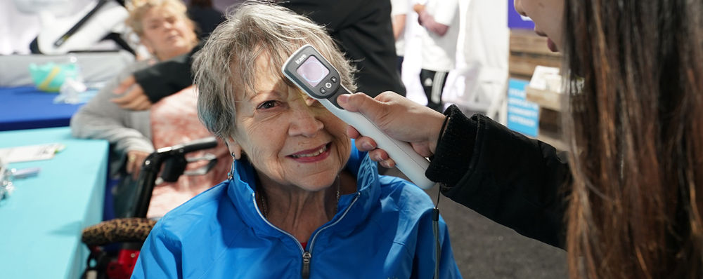An older woman receiving an eye exam.