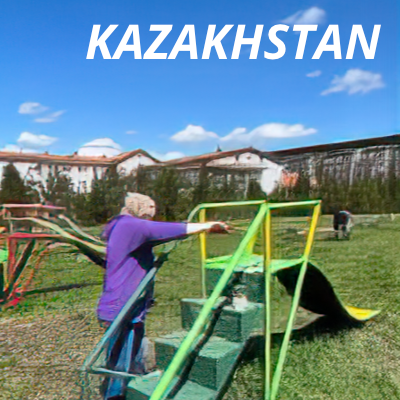 Image of an Alcon volunteer painting children's playground equipment in Kazakhstan